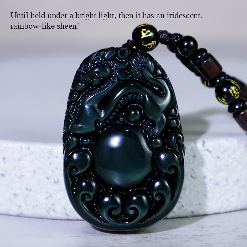 Tibetan Rainbow Obsidian PiXiu Necklace – front-facing carved PiXiu pendant with glowing green highlights, black mantra beads, prosperity amulet