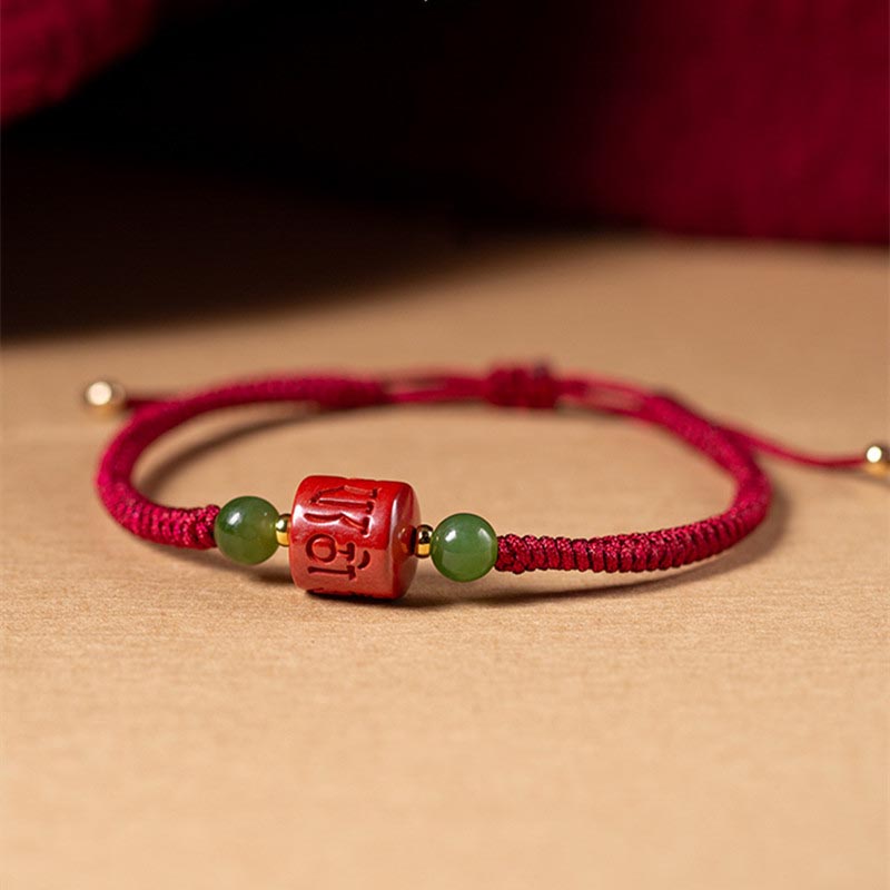 Tibetan Cinnabar Braided Rope Bracelet – Low angle view of cinnabar bead and adjustable sliding knot closure
