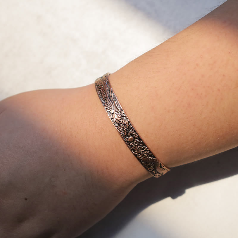 Dragon Phoenix Copper Cuff Bracelet – Phoenix feather detail on wrist, oxidized copper finish, Fortune
