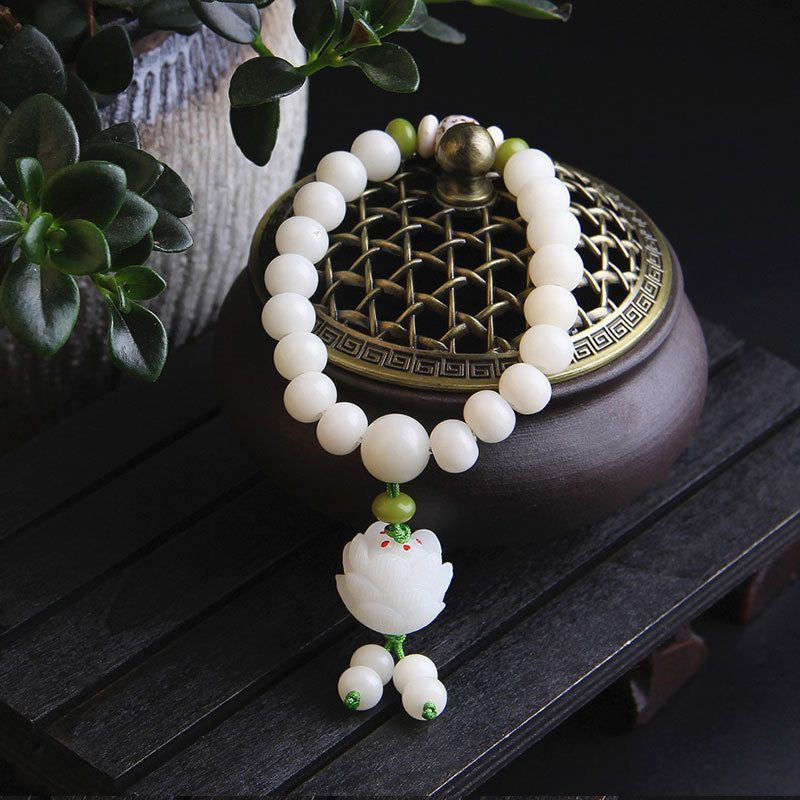 Natural Bodhi Seed Bracelet – White beads and carved lotus pendant with tassel, styled with incense burner