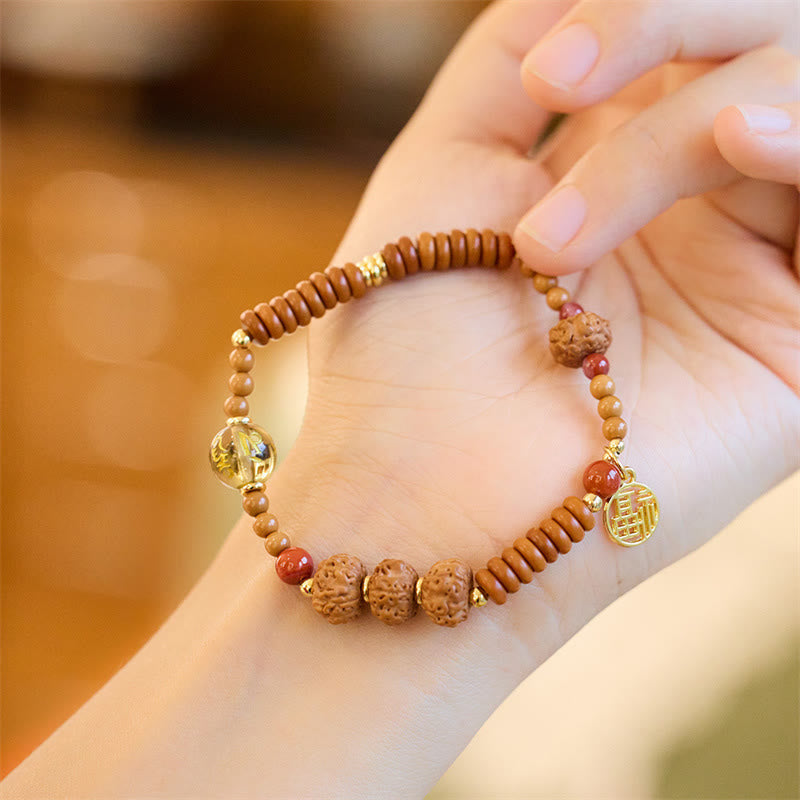 Bodhi Seed Bracelet – Rudraksha beads and translucent amber accent on wrist, spiritual bracelet