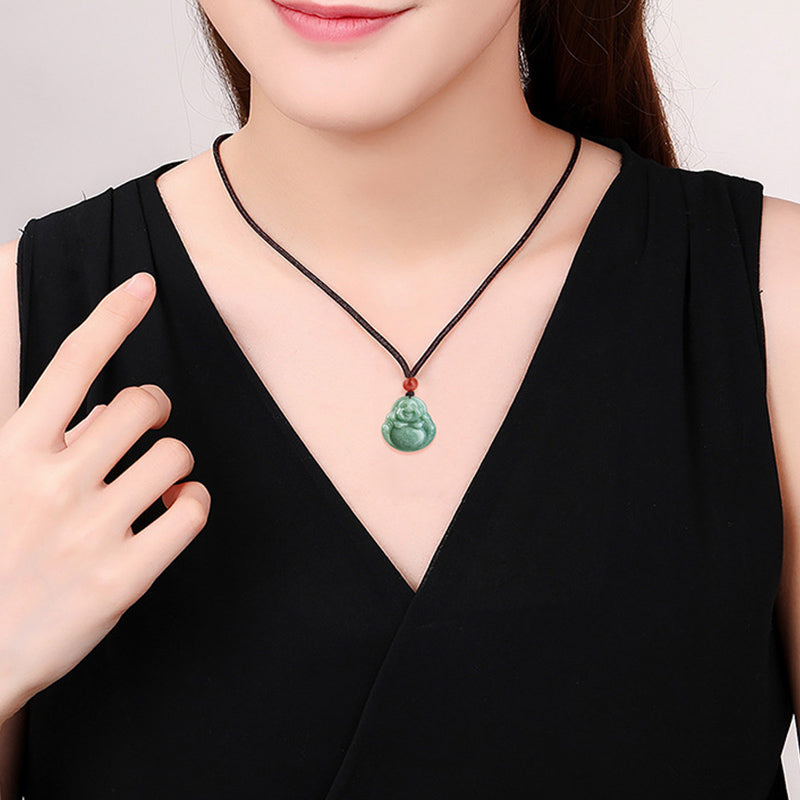 Cyan Jade Laughing Buddha Necklace - Worn by woman in black dress front view