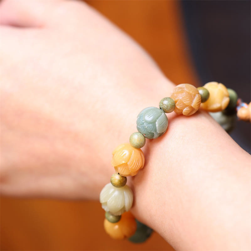 Bodhi Seed Green Sandalwood Lotus Bracelet – sage and peach lotus beads on wrist, Calm