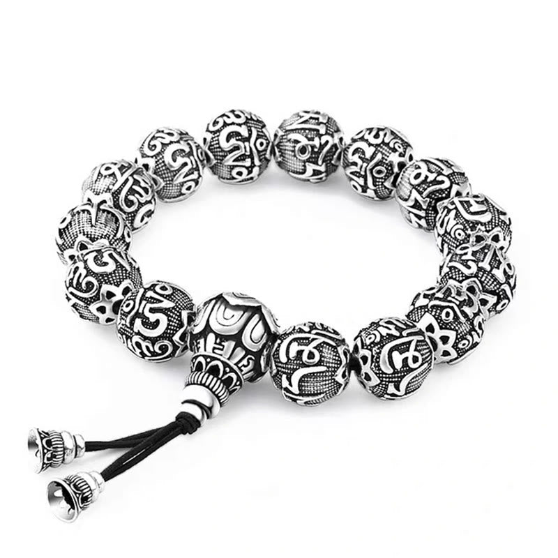 Om Mani Padme Hum Bracelet – White background shot of carved mantra beads and tassel