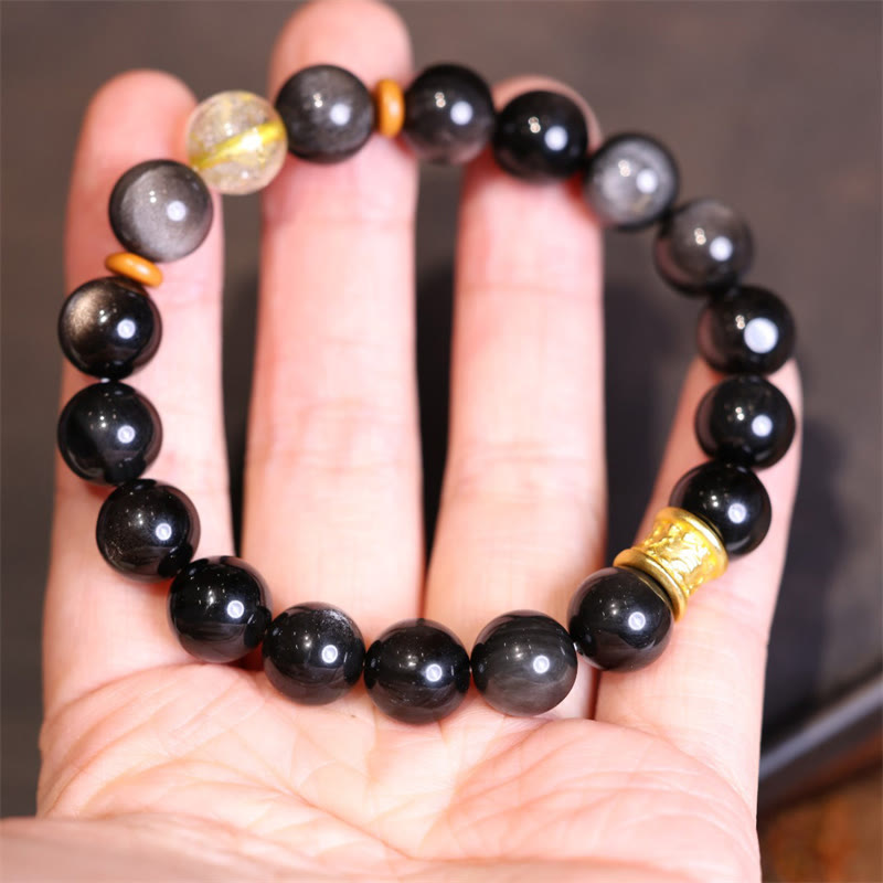 Silver Sheen Obsidian Mantra Bracelet – worn on hand showing full fit and bead variety, wrist mala bracelet