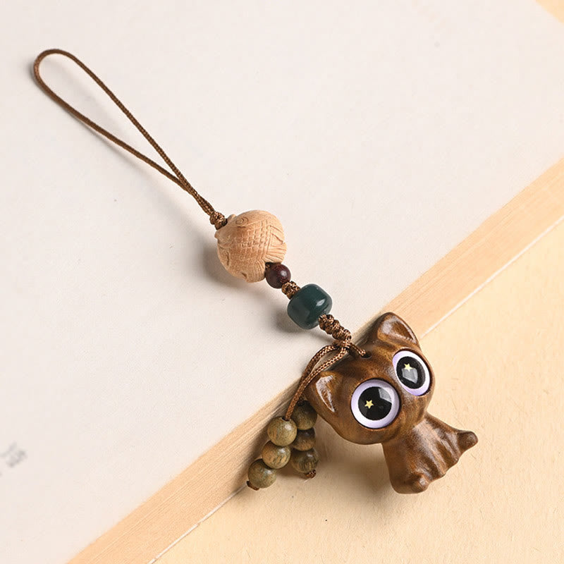 Green Sandalwood Key Chain – coiled on dark background, lucky cat eyes, koi fish scales