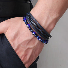 Evil Eye Tiger Eye Bracelet – Layered blue beaded leather bracelet worn on male wrist, casual style