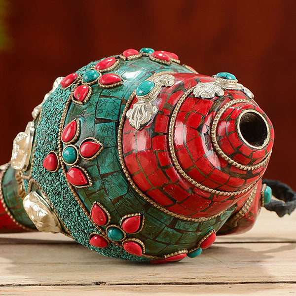 Turquoise Shankha Conch – held in palms showing compact size and intricate stone placement, spiritual gift