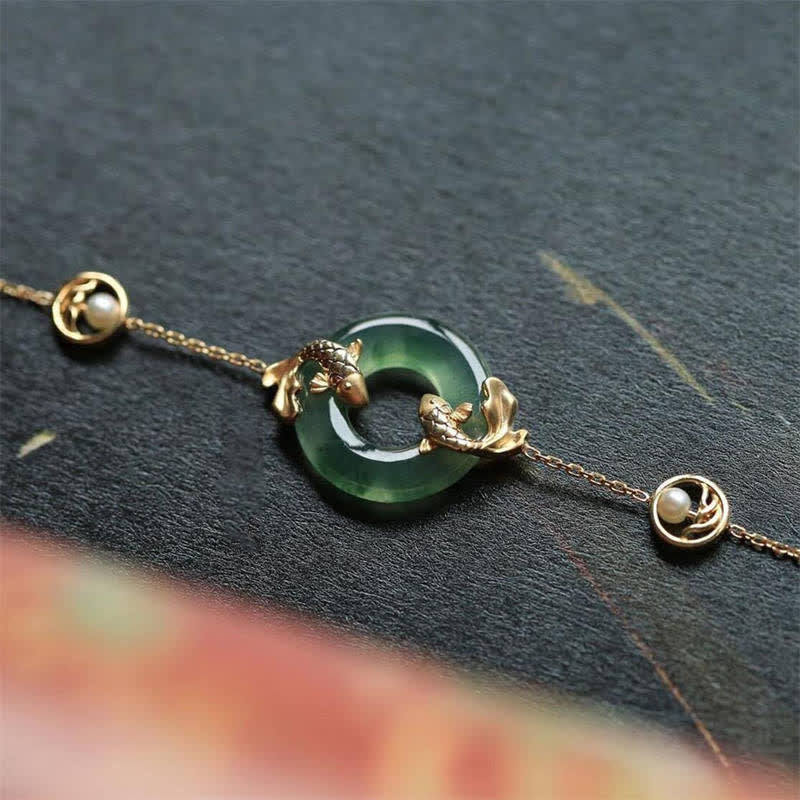 Cyan Jade Koi Bracelet - close-up of koi fish pendant on cyan jade beaded strand