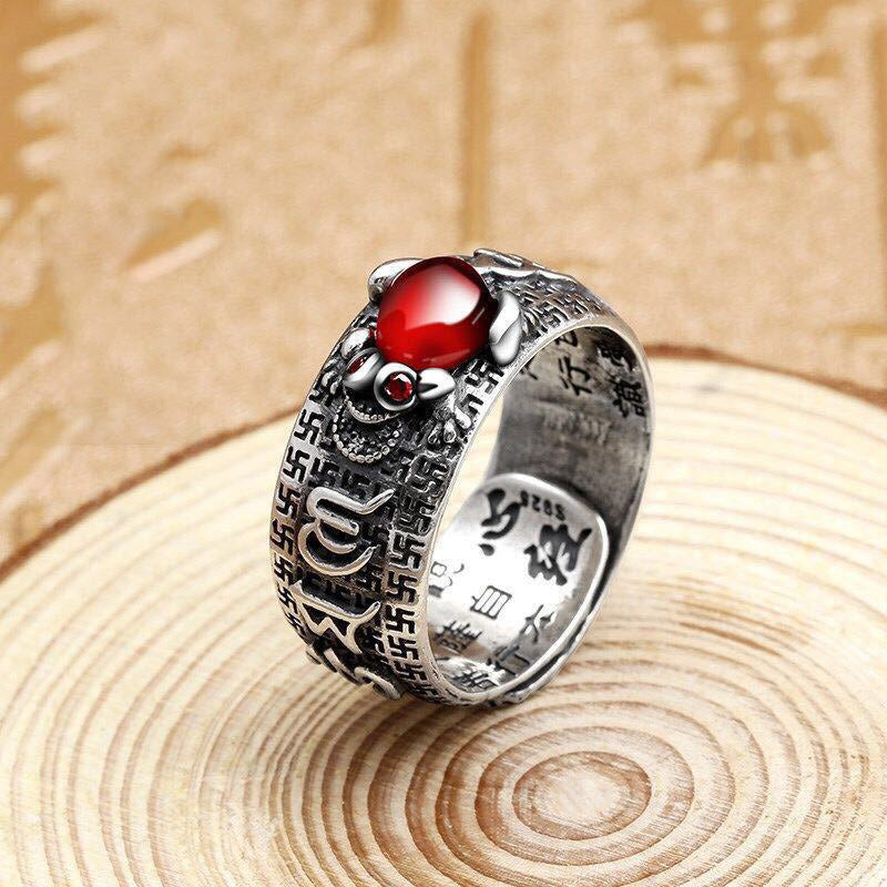 Feng Shui PiXiu Ring – Silver ring with red stone on wood slice, Chinese calligraphy background