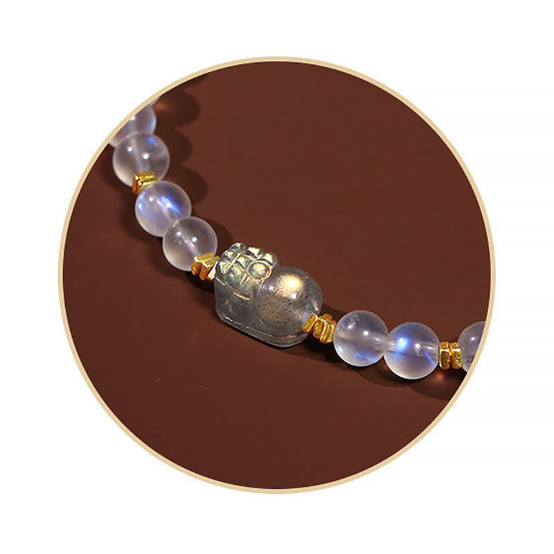 Moonstone PiXiu Bracelet – Circular crop close-up of PiXiu charm and moonstone beads detail, crystals
