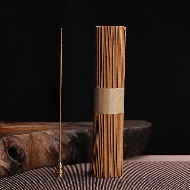 Tibetan Lotus Incense Burner – Lit incense stick with rising smoke on black, incense stick