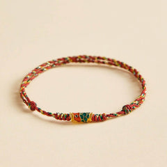 Koi Fish Wealth Bracelet – Close-up of koi fish wealth charm on red string, Feng Shui bracelet