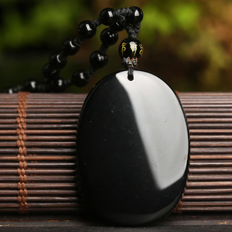 Black Obsidian Koi Fish Bead Rope Necklace – side angle showing pendant depth and bead luster, black gemstone