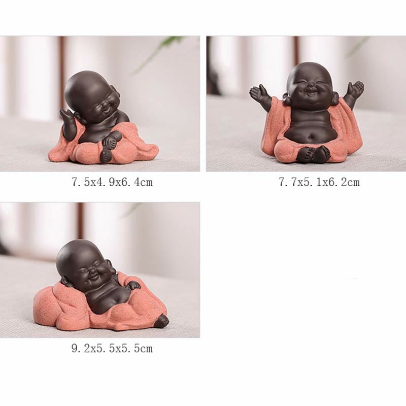 Laughing Buddha Purple Clay Maitreya Statue – close-up of reclining figure showing smooth dark ceramic skin against soft purple fabric, tranquil bedside decor