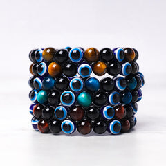 Evil Eye Tiger Eye Bracelet – stacked multi-row black onyx tiger eye and blue evil eye bead collection