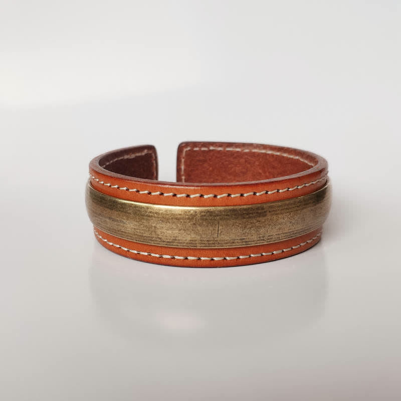 Om Mani Padme Hum Dragon Phoenix Bracelet - Tan leather cuff with antique brass center plate on white background, Peace