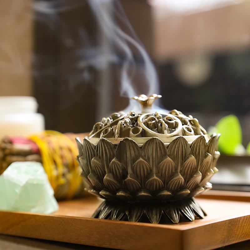 Lotus Incense Burner with lid removed, carved lotus interior on stone surface, zen