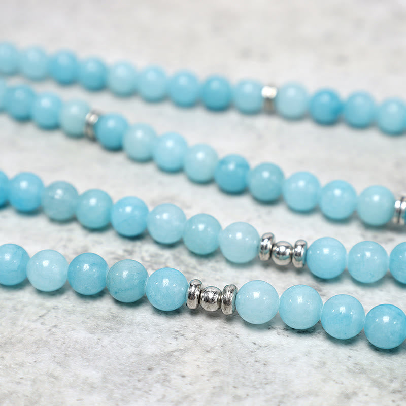 Amazonite Lotus Mala Bracelet macro detail of polished blue amazonite beads and silver spacers