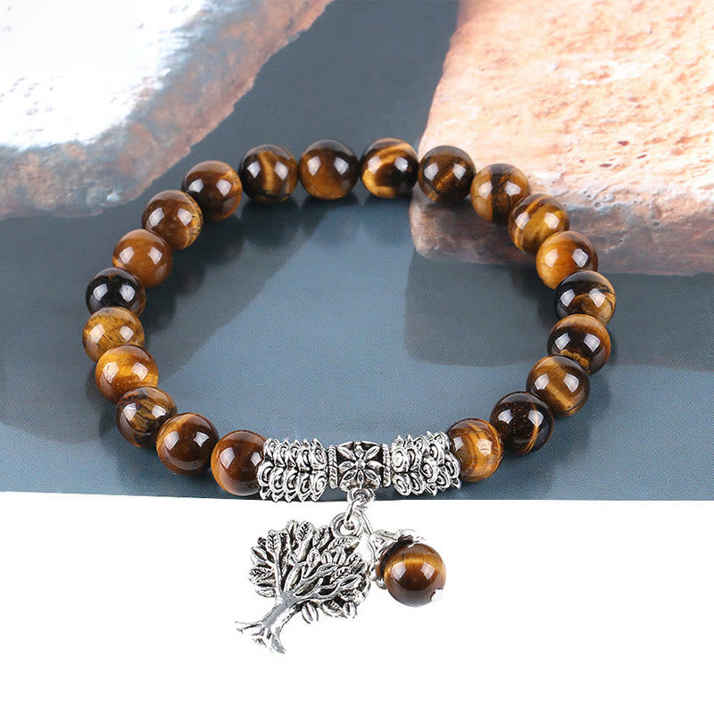 Tree of Life tiger eye bracelet with chatoyant golden-brown and dark brown beads, silver Tree of Life pendant, silver metal spacer accents.