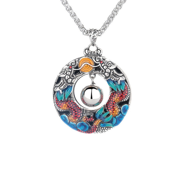 Double Dragon Copper Necklace – Front view of double koi harmony ball pendant, turquoise coral enamel, white background