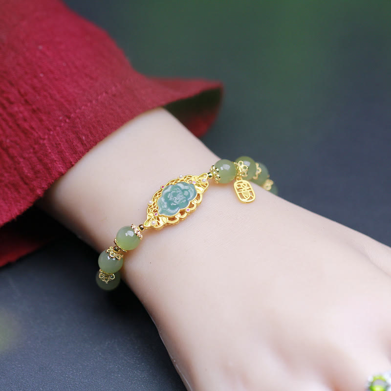 Hetian Jade Lotus Bracelet - worn on wrist showing carved lotus focal and jade beads, wrist bracelet