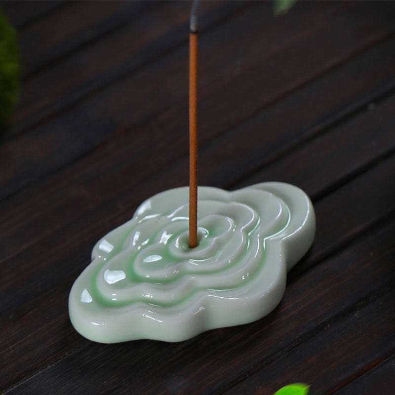 Mini Auspicious Clouds Ceramic Incense Burner – green ruyi cloud-shaped holder with concentric ripple and smoke on wood, ceramic incense burner