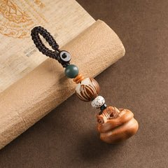 Peach wood Feng Shui keychain without peanut, featuring carved persimmon and agate beads