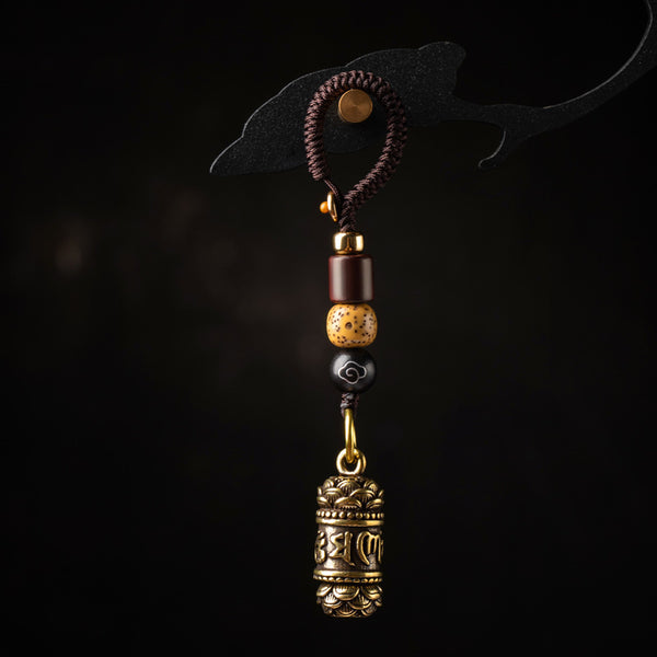 Tibetan Om Mani Padme Hum Brass Car Ornament – B, angled view