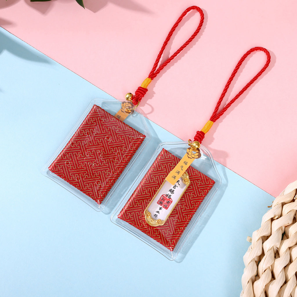 Two red career blessing amulets on pink and blue background
