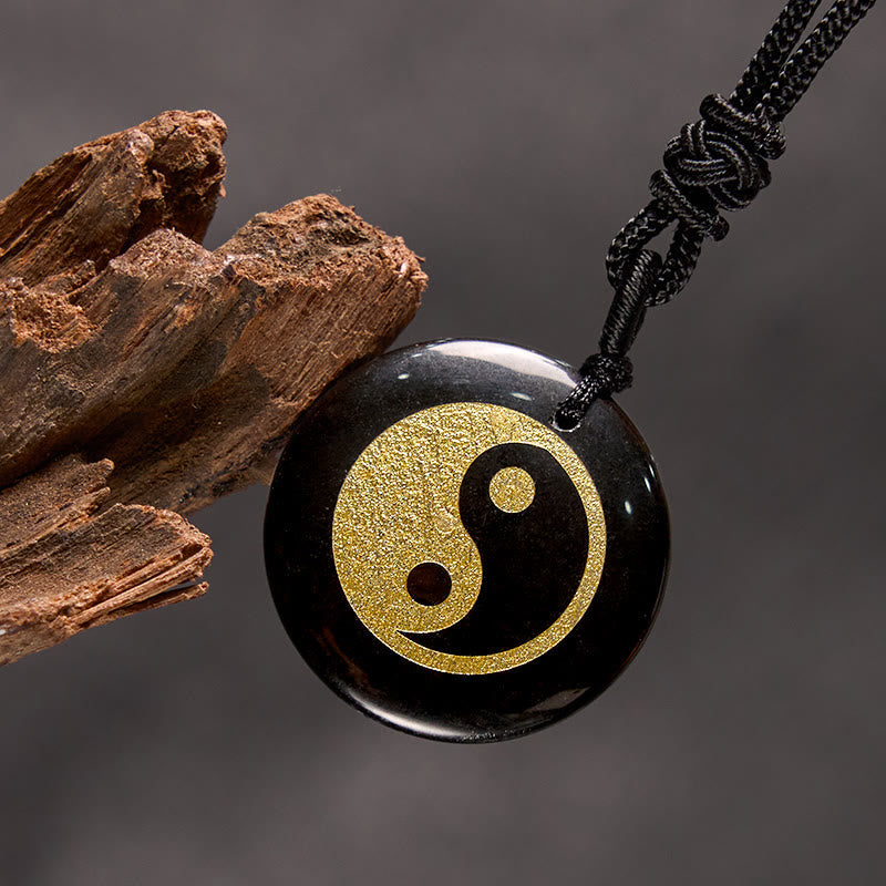 Yin Yang Crystal Necklace – Black obsidian pendant with gold glitter yin-yang symbol on black cord, round polished gemstone d