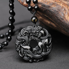 Black Obsidian Pixiu Pendant – Carved black obsidian peace buckle with Pixiu motif, beaded chain