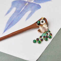 Red Sandalwood Green Agate Hairpin, wooden hairpin with gold ginkgo leaf, side angle view