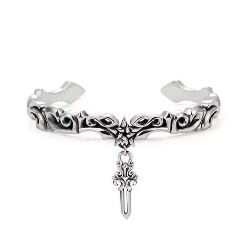 Viking twisted braided bracelet on white background showing oxidized silver finish ornate scrollwork filigree patterns and central sword-shaped pendant