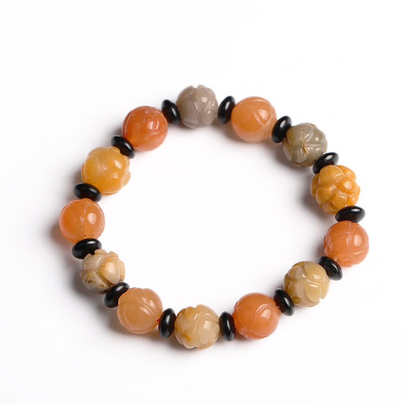 Golden Silk Jade Lotus Bracelet – Multi-color lotus beads with black spacers on white, golden silk lotus bracelet