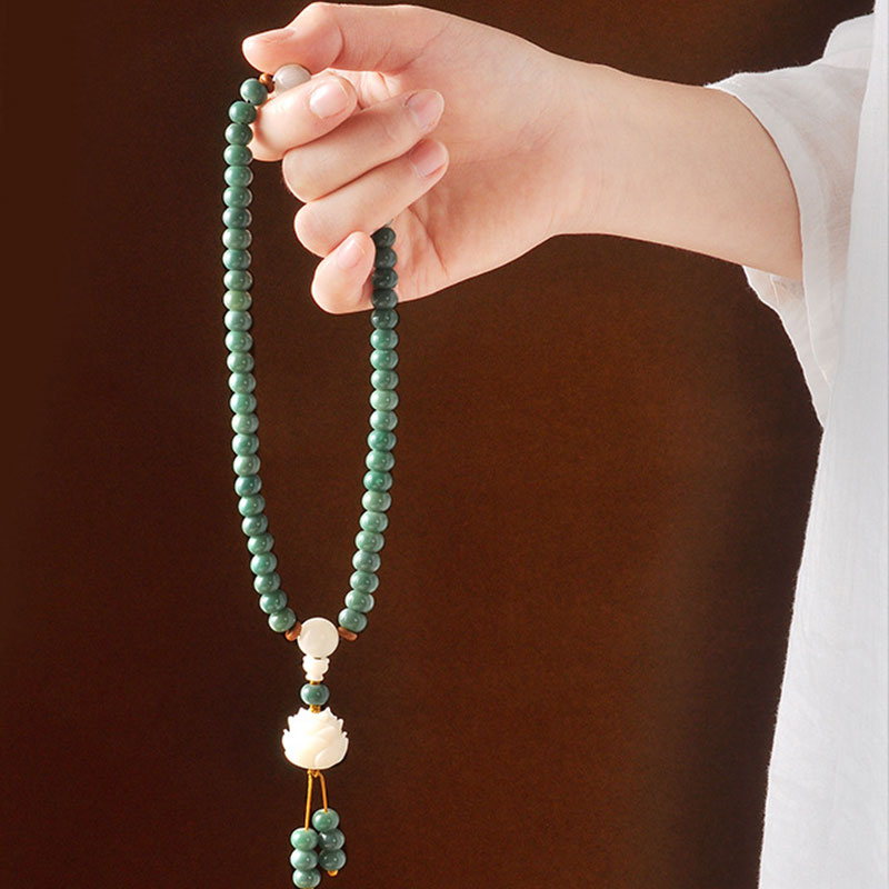 Bodhi Seed Lotus Bracelet – 108-bead mala necklace held in hand with lotus drop, bodhi seed