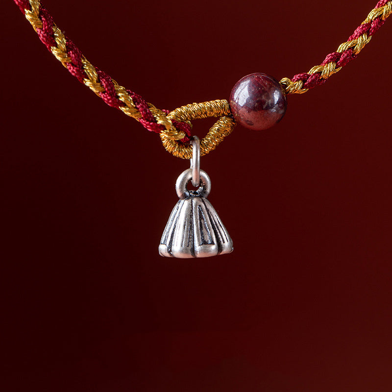 Red Gold Rope Lotus Braid Bracelet - close-up bell charm with traditional knotwork, cord bracelet