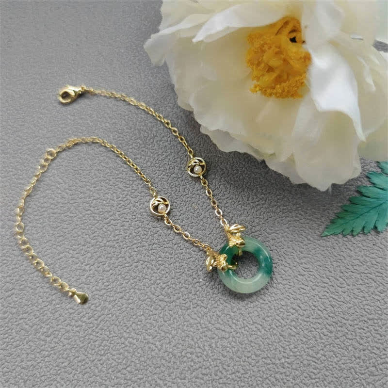 Cyan Jade Healing Bracelet - bracelet on white background, cool cyan tones, calming