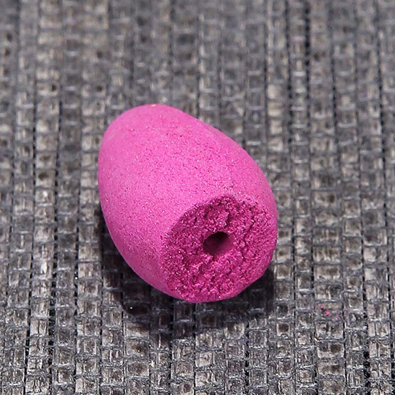 Tibetan Lotus Incense Burner – Assorted cones spilling from bag on wood, bulk incense