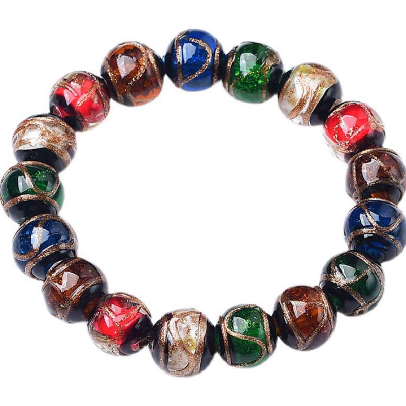 Colorful Liuli Glass Bead Luck Bracelet – Multicolored translucent glass beads with pale blue center on cream pleated fan, decorative gray-blue backdrop, top-down