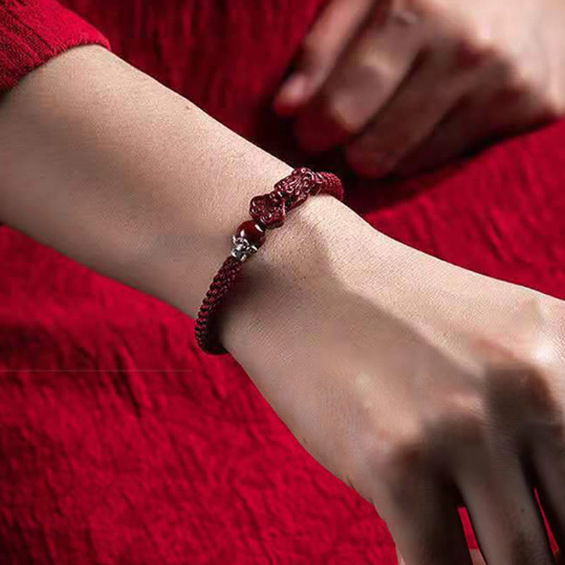 Handcrafted PiXiu Cinnabar Wealth Luck Braided Bracelet – wrist worn with red fabric sleeve, daily wear luck charm