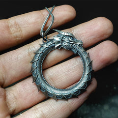 Pure Tin Dragon Snake Necklace - Ouroboros pendant held in hand, intricate scales, guardian jewelry