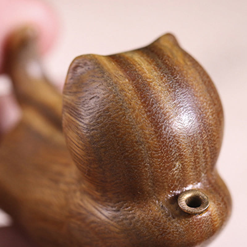 Green Sandalwood Cat Incense Burner - Close-up of carved head with brass inlay detail