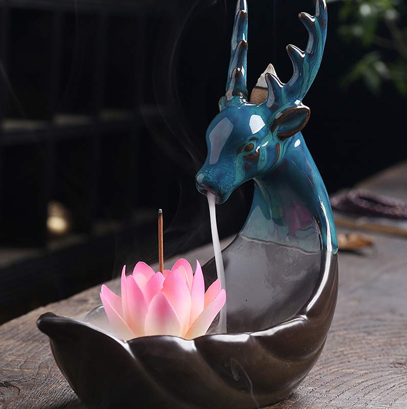 Little Deer Ceramic Lotus Incense Burner – Teal deer sculptural backflow burner with white smoke stream and pink lotus base