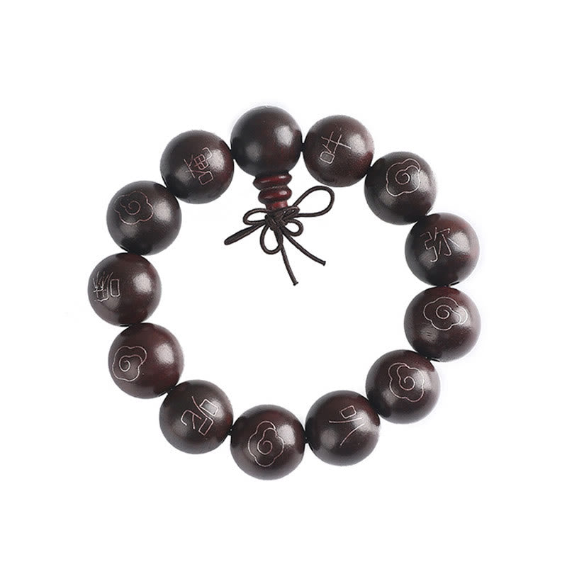Sterling Silver Sandalwood Mantra Bracelet – white background flat lay of mantra beads, pure product shot