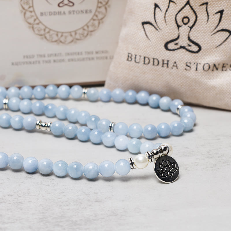 Aquamarine Mala Necklace – draped blue beads with lotus charm, mindful