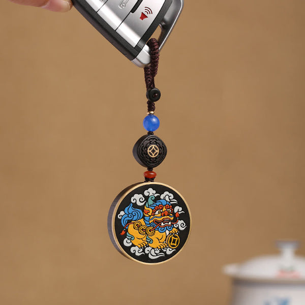 PiXiu Coin Keychain – Colorful PiXiu medallion on car key with blue bead and ebony accent