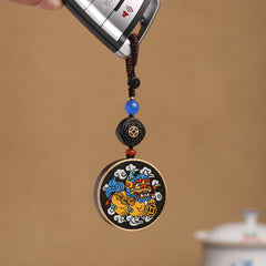 PiXiu Coin Keychain – Colorful PiXiu medallion on car key with blue bead and ebony accent
