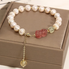 Pearl Strawberry Quartz PiXiu Bracelet – Freshwater pearls with pink PiXiu on brown jewelry box