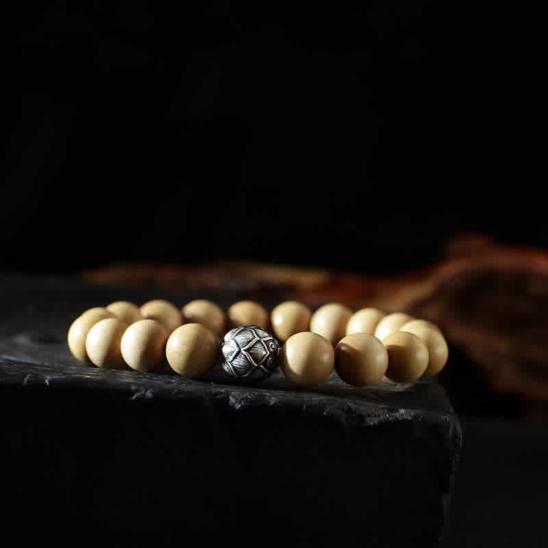 Peach Wood Yin Yang Bracelet – Tessellated metal guru bead on natural wood mala bracelet, zen